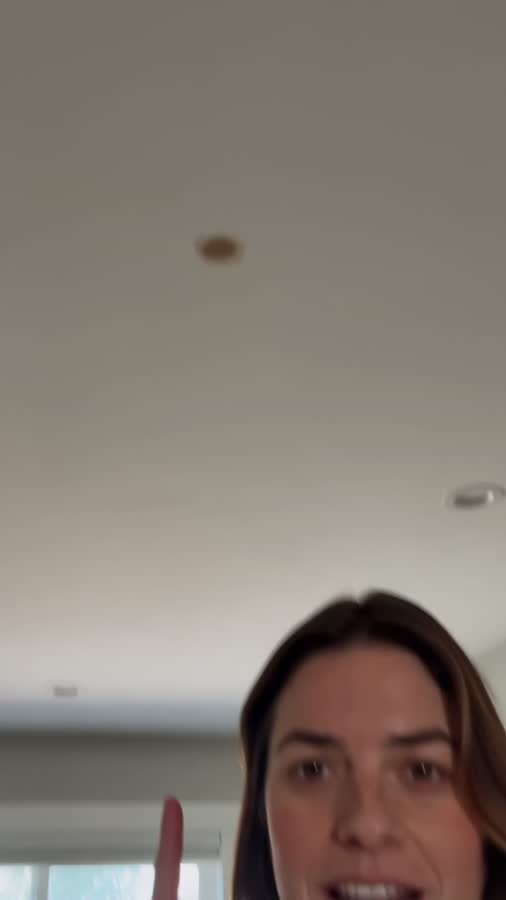 Homeowner speaking to camera in a bright room